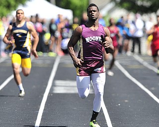 Mooney runner Marcus McWilson breaks away from the pack during the final stretch of the boys 4x200 meter relay.
