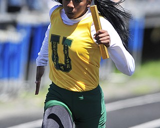 Ursuline runner Alexandra Carnathan sprints to the finish line to finish fist during the girls 4x100 meter relay. 