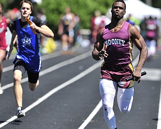 Mooney runner Marcus McWilson pulls away from Lakeview runner Ben Biehl during the final leg of the boys 4x100 meter relay.