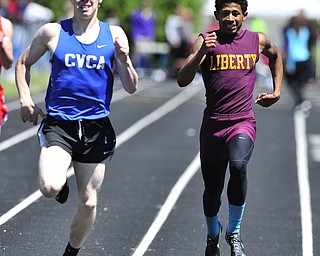Liberty runner John Helms attempts to close the gap between him and CVCA runner Sherman Kortze during the final stretch of the boys 400 meter dash.