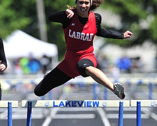 Labrare hurdler Megan Gunther clears the final hurdle on her way to finishing first during the girls 300 meter hurdles.