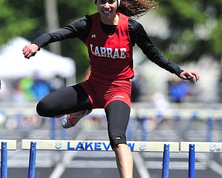 Labrare hurdler Megan Gunther clears the final hurdle on her way to finishing first during the girls 300 meter hurdles. 