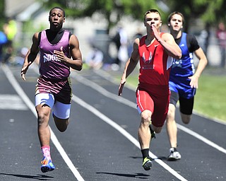 Mooney runner Jayshawn Coleman pulls away from Crestview runner Brendan Fannin and Lakeview runner Ben Biehl during while sprinting to the finish line during the boys 200 meter dash. 