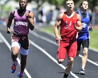 Mooney runner Jayshawn Coleman pulls away from Crestview runner Brendan Fannin and Lakeview runner Ben Biehl during while sprinting to the finish line during the boys 200 meter dash. 