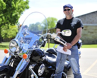 Brian Begg of Warren, Ohio stands beside his Kawasaki Vulcan Nomad motorcycle Saturday afternoon at Christ Episcopal Church in Warren.
It was Begg's idea to have the blessing of the bikes and riders.