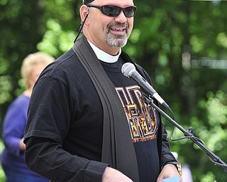 Reverend Jeff Baker gives his blessing of bikes and riders Saturday afternoon at Christ Episcopal Church in Warren.