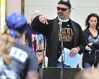 Reverend Jeff Baker gives his blessing of bikes and riders Saturday afternoon at Christ Episcopal Church in Warren.