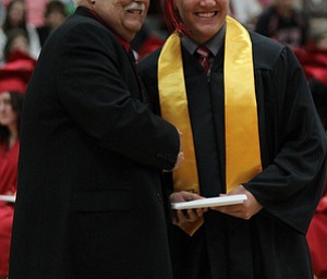 .IMG 9307: ÊAnthony Lariccia poses for a picture withÊBoard of Education president Ron CarcelliÊduring commencement at the Struthers Field House on Sunday. ÊDustin Livesay Ê| ÊThe Vindicator Ê5/26/13 ÊStruthers High School. Ê