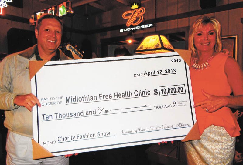SPECIAL TO THE VINDICATOR
Mahoning County Medical Society Alliance presented a check for $10,000 to the Midlothian Free Health Clinic in Youngstown during a joint meeting April 19 at Cassese’s MVR Restaurant in Youngstown. The proceeds were from the annual charity fashion show in February. Above, Dr. Thomas Albani Jr. is medical director of the clinic, and Michelle Duffett is president of the alliance. The clinic provides basic primary care for those without health insurance. The alliance is a group of physicians’ spouses who promote the goals of the local medical society.