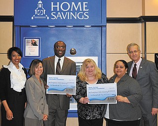 SPECIAL TO THE VINDICATOR
Home Savings Charitable Foundation donated $10,000 to two programs at Youngstown State University. The Summer Bridge Program, a multicultural student retention program, and Beeghly College of Education Boot Camp, a learning community for students of color  designed to retain students in the program, each received $5,000. From left are Jacquelyn Johnson, YSU development officer; Jonelle Beatrice, interim executive director, Student Life at YSU; Michael Beverly, senior coordinator II, Center for Student Progress, YSU; Jeanne Watson-Antol, retail manager, YSU Home Savings; Crystal Hawthorne, coordinator of teacher certification/licensure, YSU; and Charles Howell, Dean of the college of education, YSU. For information about YSU call 330-941-3000 or visit www.ysu.edu.
