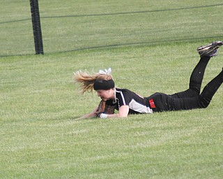 The ball rolls away from Canfield’s right fielder Sydney Opladen after a diving attempt in the sixth inning of Wednesday’s Division II regional semifinal against Navarre Fairless at Firestone Stadium in Akron. On the play, Opladen sprinted toward center where the ball glanced off the top of her glove. The Cardinals fell 6-2 to the Falcons.
