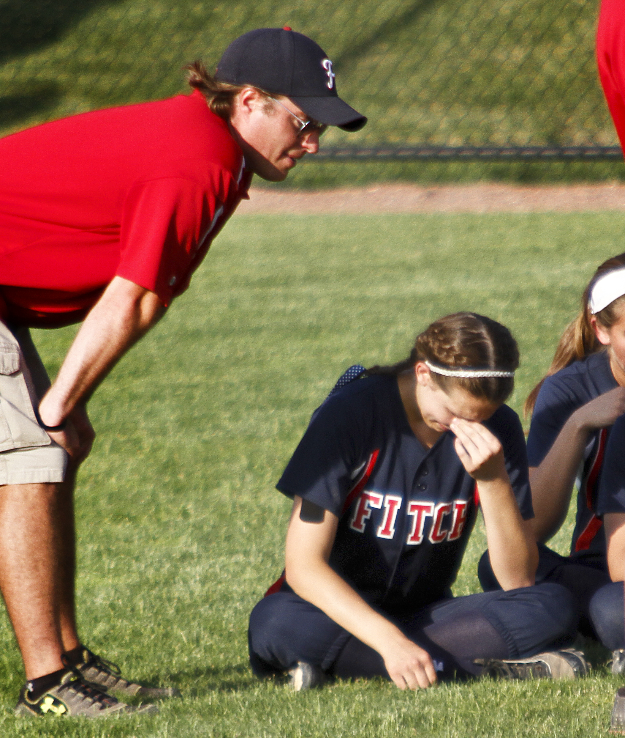 MADELYN P. HASTINGS I THE VINDICATOR

Coaches talk with the Fitch girls after they lost their game against Medina 5-3 at the University of Akron on May 30, 2013. 