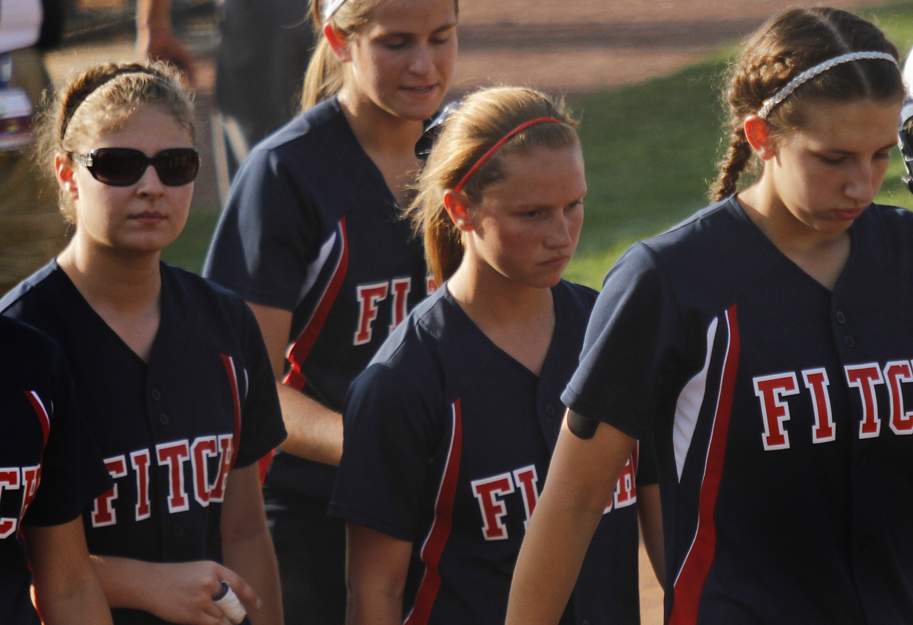 MADELYN P. HASTINGS I THE VINDICATOR

Fitch girls walk away disappointed after they lost their game against Medina 5-3 at the University of Akron on May 30, 2013. 