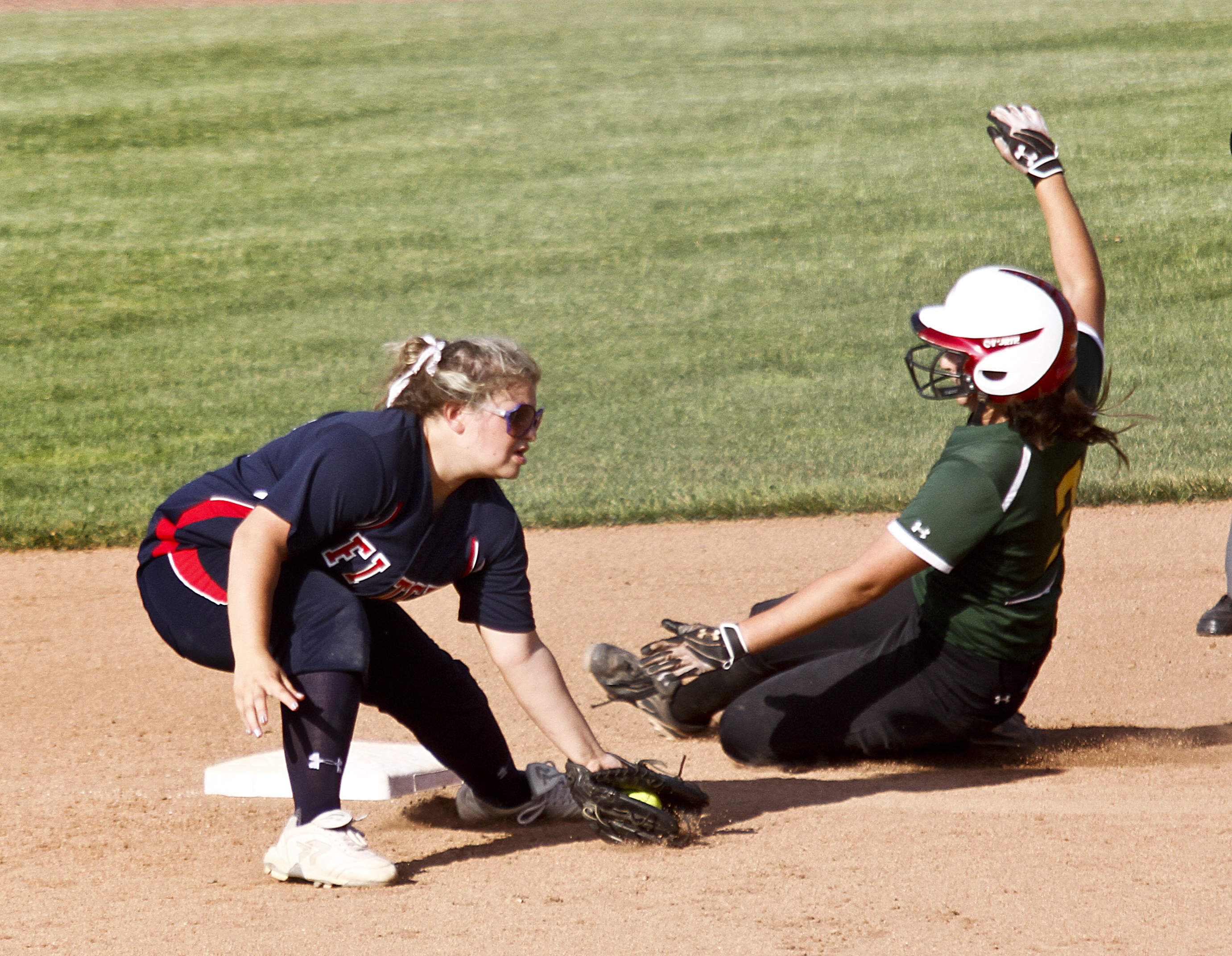 MADELYN P. HASTINGS I THE VINDICATOR

Fitch's Alessandra Corradi (13) fails to tag Medina's Lauren Peak (3) as she slides into third base during their game at the University of Akron on May 30, 2013. Fitch lost to Medina 5-3.
