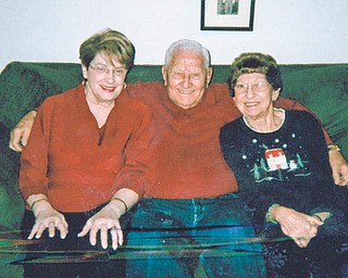 Betsy Koneval of Youngstown, left, sent in this photo she calls "Grandparents Hug," taken of herself, her husband, John, and Mary Fonner of Youngstown. Betsy says, "Whenever our family and friends get together, there is always a lot of 'huggin' going on."