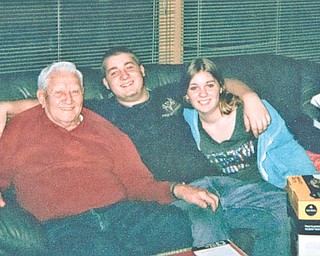 John Koneval spends time with grandchildren Corey and Jenna Fonner. All are from Youngstown. Photo sent in by Betsy Koneval, also of Youngstown.