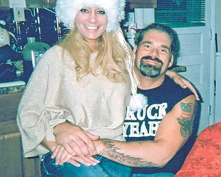 Betsy Koneval of Youngstown submitted this photo she calls "Lovin' Couple + 1," taken of her daughter, Jill Fonner, with boyfriend Truck Toth. At right is Jill's brother Russ Koneval. All live in Youngstown.