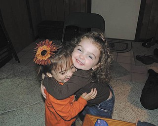 Now here are some really happy huggers! Proud grandpa James DeToro of Austintown sent in this photo of grandchildren Cecilia DeToro, 2, and Riley Collins, 3.