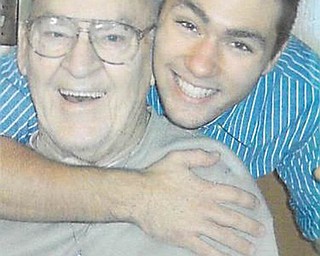 Joe Zordich gives a hug to his grandpa, Cy Deley, both of Youngstown. Photo sent in by Laura Brown, who is Joe's mom and Cy's daughter.