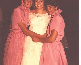 Sheri Morris sent in this photo, with this description: "This is from my wedding day, June 16, 1984, of the Donnelly sisters. Today we're known as Shelly Seese, Sheri Morris and Shannon Zappia. I'm the oldest and was the first to get married. This was taken right before I was leaving the reception."