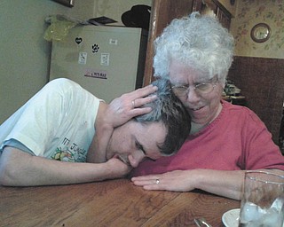 Annette Stanislaw hugs her son Alexis on Memorial Day in Lansingville. Photo sent in by Sherry Parent of Youngstown.