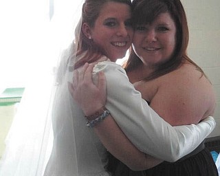 Proud mom Dawna Cramer sent in this photo of her daughters, Valerie Cramer (maid of honor) and Lyndsey Wade (bride). This was taken on Lyndsey's wedding day, Dec. 29, 2012.