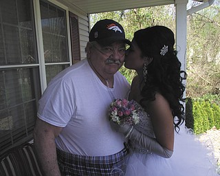 Michelle Winebold submitted this photo of her father, Ronald Hrusovski, and her daughter, Taylor Winebold. Michelle writes, "My dad is usually homebound due to his illness ... however, he made a special trip over to our house to see his granddaughter all dressed up for the Struthers High School Senior Prom on May 3."