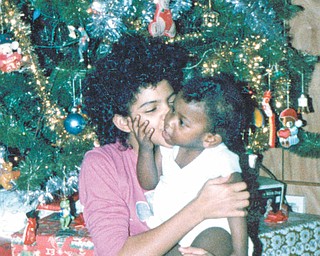 Othella May of Youngstown says it was Christmas 1986 when this picture was taken of cousins Michael and Tisha, who were 1 and 7 years old at the time. Both are of Youngstown.