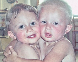 This photo of two "Happy Huggers" was taken several years ago by Grandma Sharon Valentino, but Anthony, now 5, and Vas, now 4, are still "Cuddling Cousins."