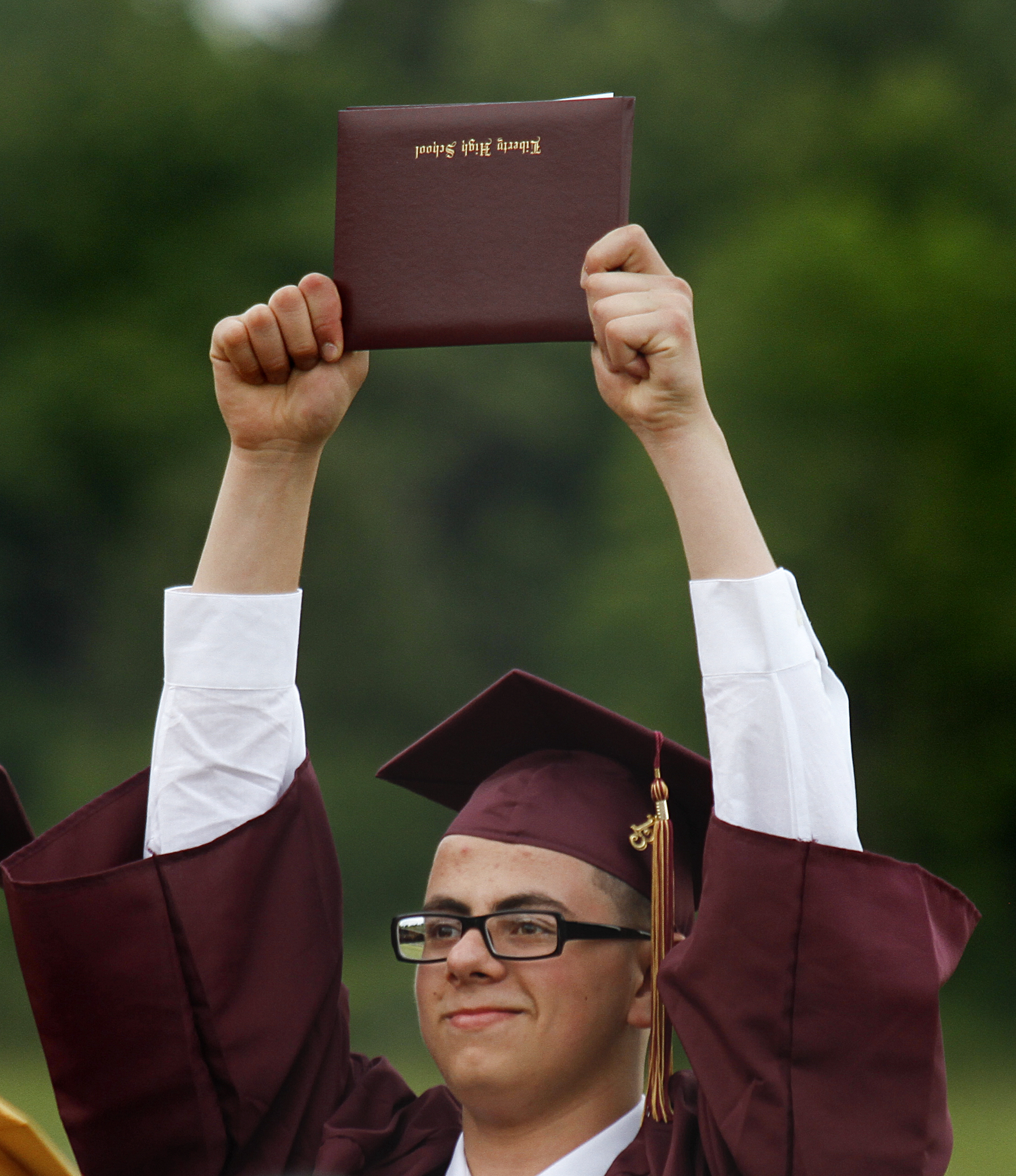 MADELYN P. HASTINGS | THE VINDICATOR

Abdallah Yusuf reacts after receiving his diploma during Liberty High School's commencement.
