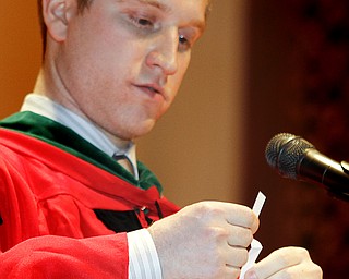 MADELYN P. HASTINGS | THE VINDICATOR
Dr. Clayton Petro, M.D., class of 2003 presents a speech about motivation to the class of 2013. He pulls names from a fish bowl and asks the students what motivates them during Ursuline High School's commencement on June 2, 2013 in Stambaugh Auditorium.