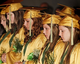 MADELYN P. HASTINGS | THE VINDICATOR
Ursuline High School graduating seniors bow their heads in prayer during commencement in Stambaugh Auditorium on June 2, 2013.