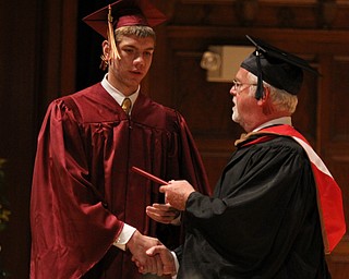 Douglas Caputo receives his diploma from Cardinal Mooney principal John Young during commencement at Stambaugh Auditorium in Youngstown on Sunday.  Dustin Livesay  6/2/13  Youngstown. 