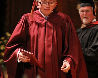 Matthew McCoy exits the stage after receiving his diploma from Mooney principal John Young during commencement at Stambaugh Auditorium in Youngstown on Sunday. Dustin Livesay 6/2/13 Youngstown.