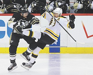 The Penguins’ Matt Cooke collides with the Bruins’ Chris Kelly in the first period of Game 2 of the Stanley
Cup Eastern Conference finals Monday in Pittsburgh. The Bruins downed the Penguins, 6-1, to take a two-game
lead in the series.