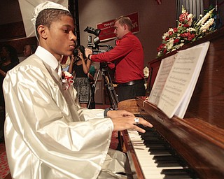 ROBERT K. YOSAY | THE VINDICATOR
two jobs.. playing pomp and circumstance is graduate Michael Nichols
Chaney Campus High School Commencement Ceremony graduates 31