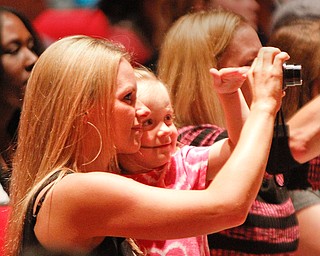 ROBERT K. YOSAY | THE VINDICATOR
amking a memory is Mia 3 Braun and Her mom Terra as they take a picture of their ( uncle and brother Phoenix M Harley
Chaney Campus High School Commencement Ceremony graduates 31