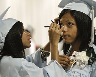 ROBERT K. YOSAY | THE VINDICATOR
Helping hand as Vernique Harris helps Breonna Hudson touch up her makeup before graduation on Thursday -
169 members of the East High School Class of 2013 who received their diplomas Thursday during the commencement ceremony at Stambaugh Auditorium.
