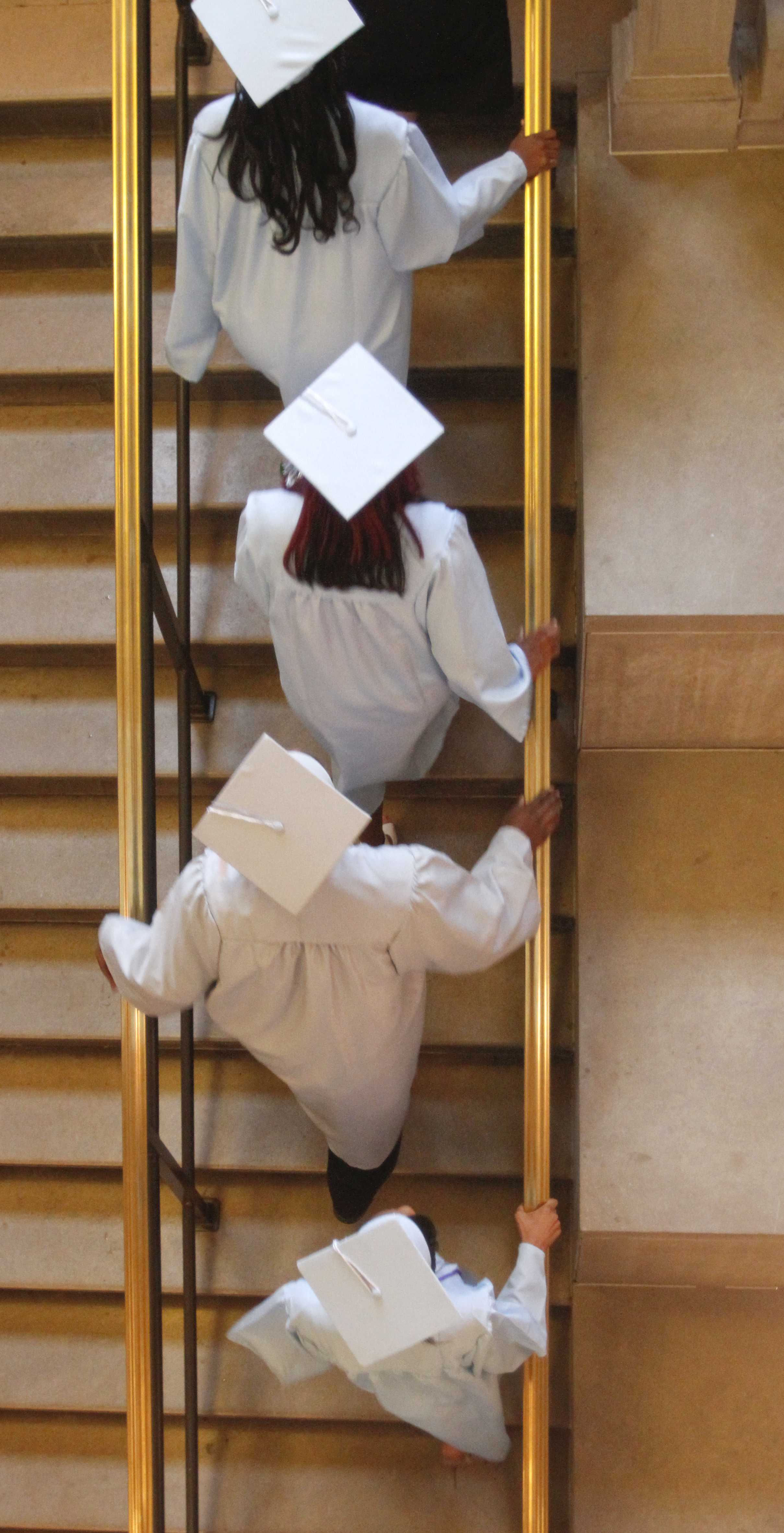        ROBERT K. YOSAY  | THE VINDICATOR

East  High Students climb the stairs as they enter  the auditorium - 

 169 members of the East High School Class of 2013 who received their diplomas Thursday during the commencement ceremony at Stambaugh Auditorium.