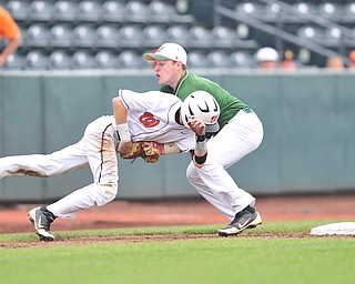 Ursuline third basemen #7 Harry Finelli tags out Wheelersburg base runner #5 Derek Arthur after he over ran third while trying to steal the base to end the top of the 7th inning. 