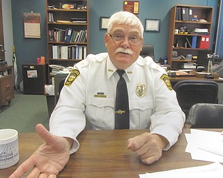 Tim Bowers, Warren police chief, makes a point during an interview at his office at the Warren Police Department. Bowers retires this month after 35 years as a police officer, four years as chief.