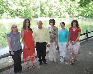 SPECIAL TO THE VINDICATOR
Standing with the Lily Pond in the background are committee members who are planning Luau at the Lily Pond, a fundraiser to help pay for a pond makeover. From left are Kirsten Peetz, MetroParks natural resources manager; Jessica Thompson, Clear Channel account executive; Louis Schiavoni, MetroParks board of commissioners president; Terri Parker, Schiavoni, Schiavoni, Bush & Muldowney; April Stanislaw, MetroParks marketing manager; and Linda Kostka, MetroParks development and marketing director.