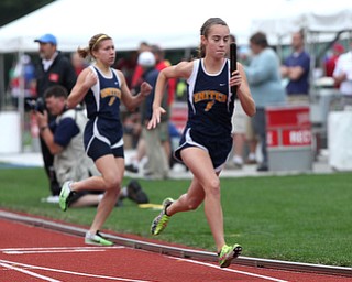 United's Maggie Briceland, right, runs after taking the handoff from Emily Guappone, left, during the OHSAA Girl's Division III State 4x800 relay Track Finals, Friday, June 7, 2013, at the Ohio State University, in Columbus, Ohio. (Photo For The Vindicator by Terry Gilliam)