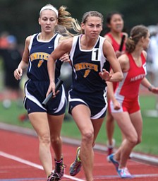 United's , Allison Parks, right, runs after taking the handoff from Chloe Bortmas, left, during the OHSAA Girl's Division III State 4x800 relay Track Finals, Friday, June 7, 2013, at the Ohio State University, in Columbus, Ohio. (Photo For The Vindicator by Terry Gilliam)