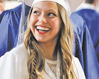 Anna Rumberg smiles at her family in the audience during Poland Seminary High School’s Class of 2013 commencement Sunday afternoon at the high school.