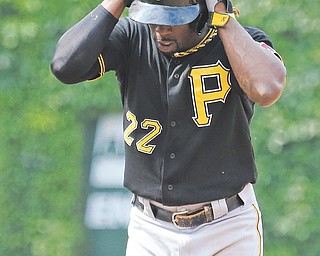 The Pirates’ Andrew McCutchen reacts after being called out on a stolen base during the ninth inning of Sunday’s baseball game against the Cubs in Chicago. The Cubs won 4-1.