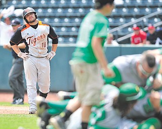 Springfield’s Cody Pitzo watches Newark Catholic celebrate its 2-1 win over the Tigers in the Division IV state baseball championship Sunday at Huntington Park in Columbus.