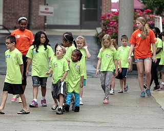 ROBERT K. YOSAY | THE VINDICATOR
walking between the buildings is common as they move from the craft area to thevocal area of the church
the Downtown Mission’s Children’s Art Camp, currently under way at St. Columba Cathedral parish hall about 25 participants enjoy the activities.
