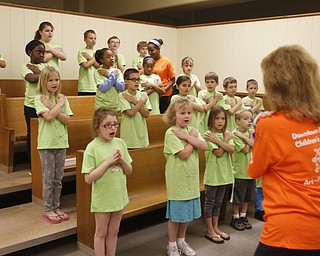 ROBERT K. YOSAY | THE VINDICATOR
Under the direction of Barb Zorn.. students at the camp learn a song for the concert at the end of the week long camp
the Downtown Mission’s Children’s Art Camp, currently under way at St. Columba Cathedral parish hall about 25 participants enjoy the activities.