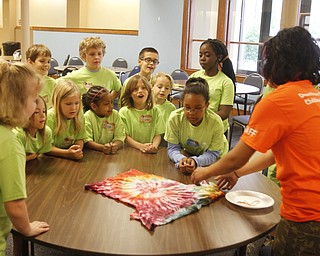 ROBERT K. YOSAY | THE VINDICATOR
Kristie Gearhart shows off the tie die shirt that the children helped make
the Downtown Mission’s Children’s Art Camp, currently under way at St. Columba Cathedral parish hall about 25 participants enjoy the activities.